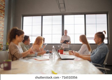 Start Up Programming Team. Website Designer Working Digital Tablet Dock Keyboard And Computer Laptop With Smart Phone And Compact Server On Mable Desk,light Effect, Red Cups.