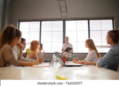 Start Up Programming Team. Website Designer Working Digital Tablet Dock Keyboard And Computer Laptop With Smart Phone And Compact Server On Mable Desk,light Effect, Red Cups.