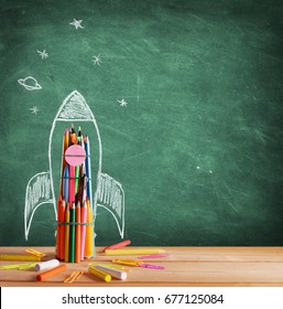 Start School Concept - Rocket Drawn On Blackboard
