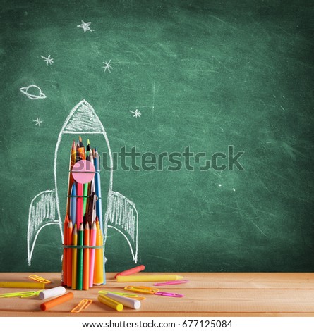 Start School Concept - Rocket Drawn On Blackboard
