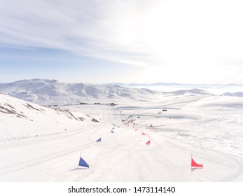 Start of a Ski Slalom competition including red and blue flags