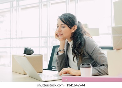 Start up small business entrepreneur SME or freelance woman working at home concept, Young woman small business owner at home office, online marketing packaging and delivery. - Shutterstock ID 1341642944