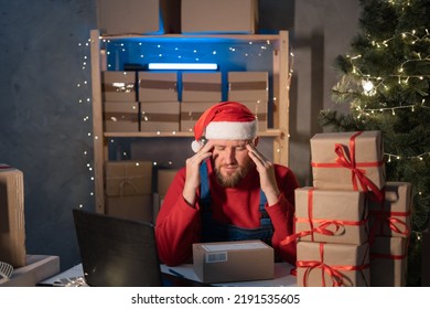 Start Up Small Business Entrepreneur SME Man In Santa Hat Working With Box At Home, Frustated Stressed Small Business Owner, Online Marketing Packaging Christmas Box And Delivery, SME Stress Concept