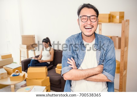 Start up small business entrepreneur SME or freelance woman and man working with box, Young Asian small business owner at home office, online marketing packaging box and delivery, SME concept   ストックフォト © 