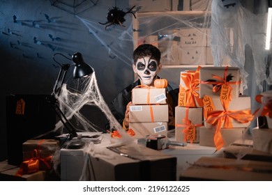 Start Up Small Business Owner Man Wear White Clay Skull, Professional Make Up In Home Office Spider And Cobweb Preparing Parcel To Send. The Concept Of A Big Sale For Halloween, Discount Promotions