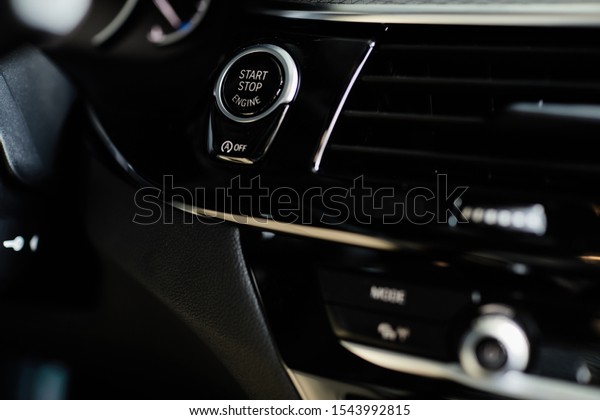 Start
stop button in a car, luxury car interior
concept