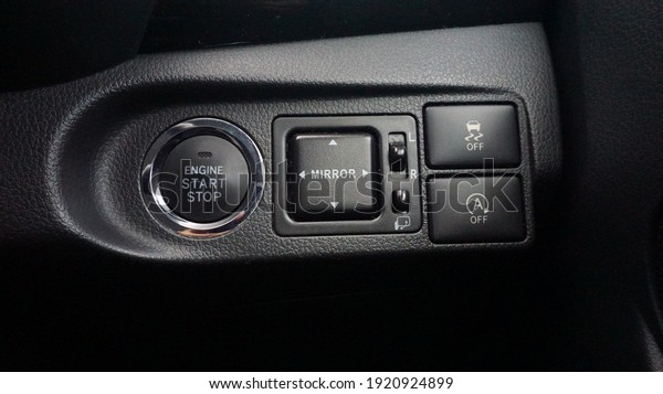 Start stop button for engine, mirror
button for side mirror, idle button in car. Black
color.