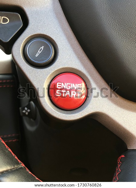 Start / Stop button. Start engine, red color.\
Supercar command, steering\
wheel.