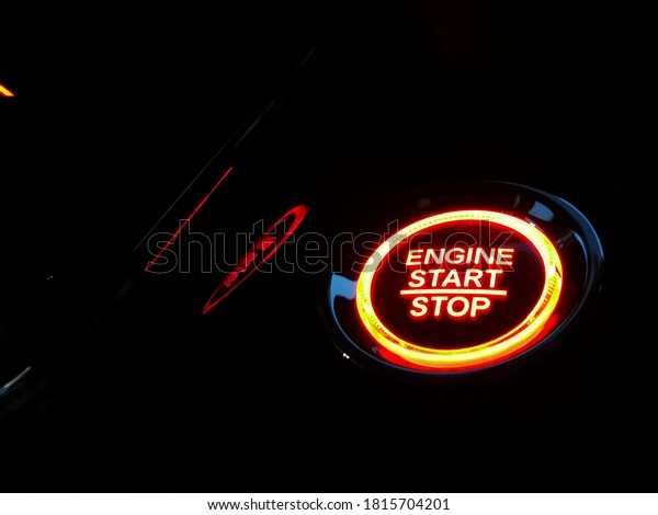 Start and stop car\
engine button in the car, new technology of car, transportation and\
safety concept.