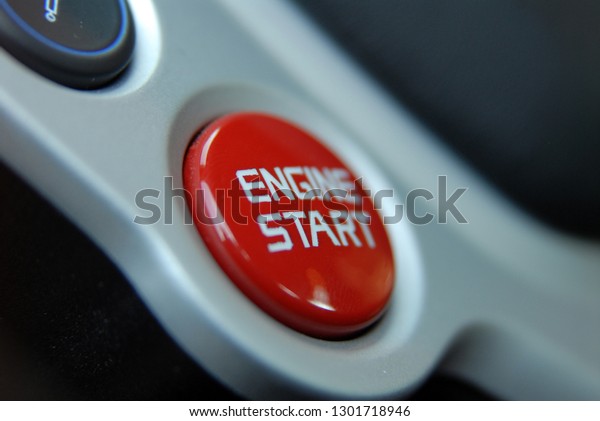 Start stop engine button on a modern sports car\
steering wheel