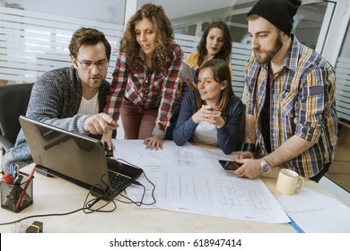 Start Up Team Of Freelancers In The Office Planning - Shutterstock ID 618947414