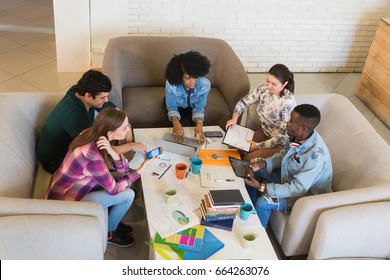 Start up team of young multiracial freelancers or students in the office presenting their ideas - Shutterstock ID 664263076