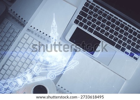 Start up theme drawing over computer on the desktop background. Top view. Double exposure. Brainstorm concept.