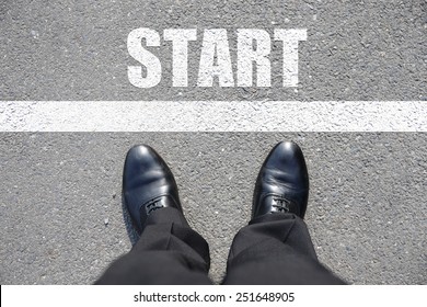 Start - top view of business man walking on the road - Powered by Shutterstock