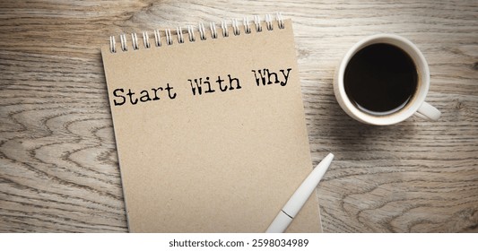 start with why text on notepad with coffee on table