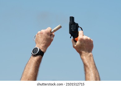 Starter Pistol Against A Blue Sky