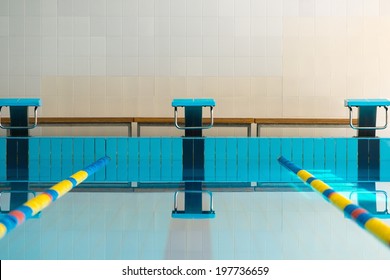 Starting Blocks And Lanes In A Swimming Pool 