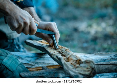 Starting A Campfire With A Fire Striker While Wilderness Camping