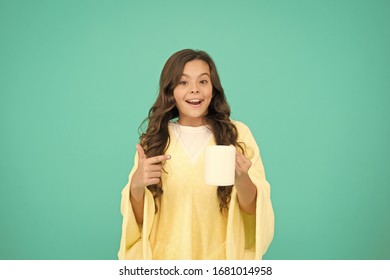 Starting Day With Breakfast. Small Kid Turquoise Background. Little Girl Drink Cocoa Or Milk Before Sleeping. Cosy And Fluffy Pajama. Feeling Comfortable At Home. Happy Girl With Hot Dring In Cup.