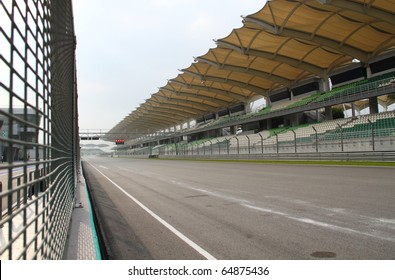 Starting & Finishing Point  Of A Race Track With Patron Grandstand Alongside. Concept Of Spectatorship For Decisive Sport Moments.