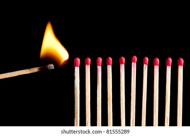 Starting The Fire - Wooden Matches In A Row Ready To Burn, Isolated On Black Background