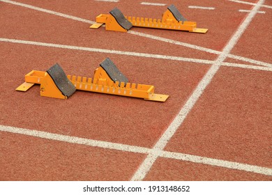 The starting gear is on the plastic track on the playground
