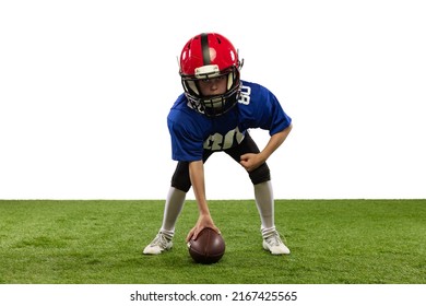 Starting Position. Athletic Kid, Beginner American Football Player In Sports Uniform And Helmet Training Isolated On White Background. Concept Of Sport, Challenges, Action, Achievements.