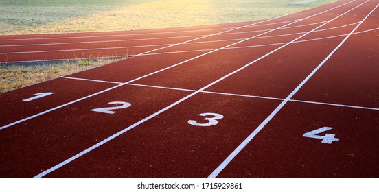 Starting position on a professional athletic track during sunset as a great opportunity