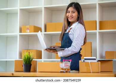 Starting Small Business Entrepreneur SME Freelance,Portrait Young Woman Working At Home Office, BOX,smartphone,laptop, Online, Marketing, Packaging, Delivery, E-commerce Concept