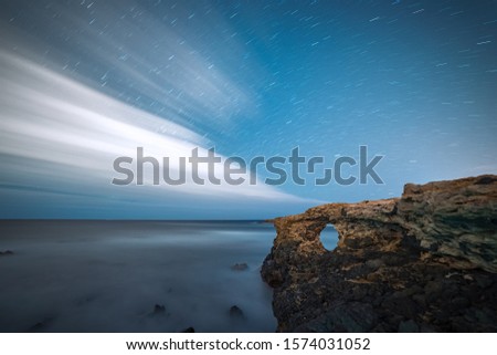 Image, Stock Photo Rocky cliff with sunset on the horizon