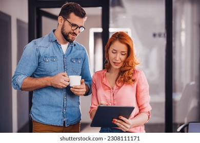 startup business team brainstorming over coffee in a modern office - Powered by Shutterstock