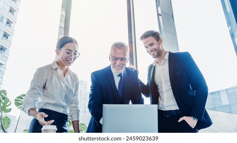 Startup business team discussion on meeting in modern office. Business professionals. Group of confident business people analyzing data using computer laptop while spending time in the office - Powered by Shutterstock