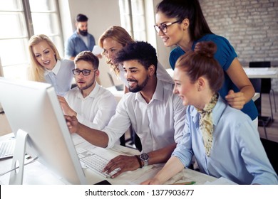 Startup business team on meeting in modern bright office interior brainstorming, working on computer - Shutterstock ID 1377903677