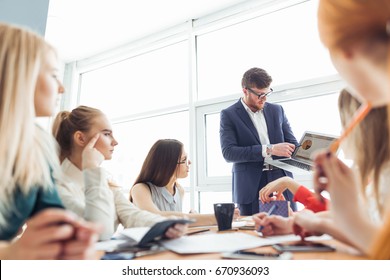 startup business team on meeting in modern bright office interior brainstorming, working on laptop and tablet computer - Shutterstock ID 670936093