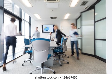 startup business, young creative  people group entering meeting room,  modern office interior and motion blur
