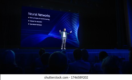 Startup Conference Stage: Speaker Presents New Product, Talks About Performance, Neural Networks, Artificial Intelligence, Big Data And Machine Learning. Live Business Event With Large Audience