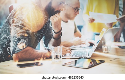 Startup Diversity Teamwork Brainstorming Meeting Concept.Business Team Coworkers Analyze Finance Report Laptop.People Working Start Up Process.Group Young Hipsters Discussing Office Blurred Background