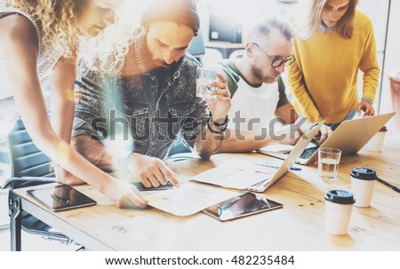 Startup Diversity Teamwork Brainstorming Meeting Concept.Business Team Coworkers Sharing World Economy Report Document Laptop.People Working Planning Start Up.Group Young Hipsters Discussing Cafe