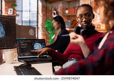 Startup engineers leveraging artificial intelligence tech in workspace to gain competitive edge. Silicon Valley company IT professionals cooperating to do rapid technological advancement