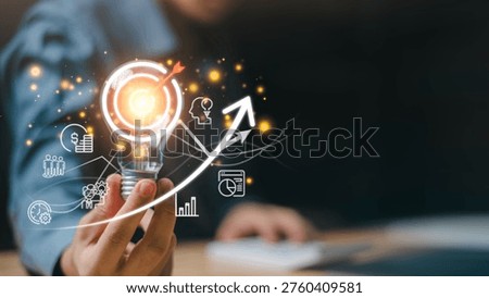 Startup founder showcasing creative vision with illuminated light bulb and upward trend arrow, highlighting business growth strategy, performance analytics, profit expansion, and leadership mindset.