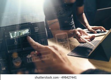 StartUp Programming Team. Website designer working digital tablet dock keyboard and computer laptop with smart phone and compact server on mable desk,light effect - Shutterstock ID 498427441