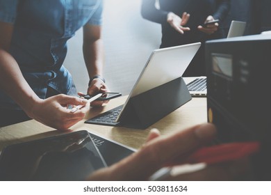 StartUp Programming Team. Website Designer Working Digital Tablet Dock Keyboard And Computer Laptop With Smart Phone And Compact Server On Mable Desk,light Effect         