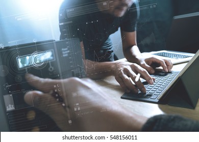StartUp Programming Team. Website designer working digital tablet dock keyboard and computer laptop with smart phone and compact server on mable desk,light effect - Shutterstock ID 548156011