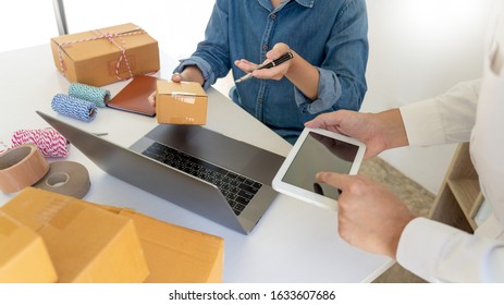 Startup Small Business Entrepreneur SME, Young Asian Man Working With Laptop Computer And Delivery Packaging Box, Online Market Packing, SME E-commerce Seller Concept