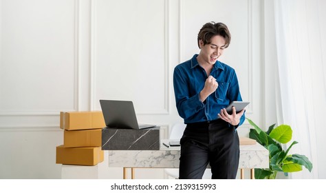 Startup small business entrepreneur SME, asian man receive order on phone. Success young Asian small business owner home office, online sell marketing delivery, SME e-commerce telemarketing concept
