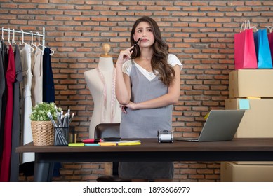 Startup Small Business Owner Working At Home, Women Thinking About Her Business Future, Online Shopping And Ecommerce Concept