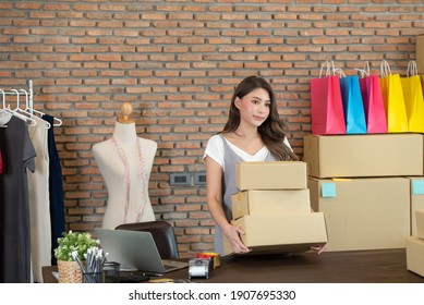 Startup small business owner working at home, women seller holding cardboard boxes preparing for dispatching, Online shopping business, ecommerce and delivery to customer concept