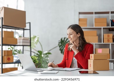 Startup small business SME, Entrepreneur owner using tablet taking receive and checking online purchase shopping order to preparing pack product box. Selling online ideas concept - Powered by Shutterstock