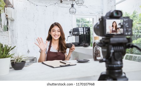 Startup Successful Small Business Owner Sme Beauty Vlogger Girl Video Online Marketing Camera In Cafe. Portrait Young Asian Woman Barista Cafe Owner. SME Entrepreneur Blogger Online Business Concept