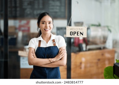 Startup successful small business owner sme beauty girl stand with arms crossed in coffee shop restaurant. Portrait of asian tan woman barista cafe owner SME entrepreneur seller business concept - Powered by Shutterstock